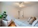 Comfortable bedroom with natural light, hardwood floors, an accent chair, and ample space at 586 S Corona St, Denver, CO 80209