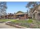 Charming brick home with a well-manicured lawn and inviting front porch at 586 S Corona St, Denver, CO 80209