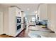Stylish kitchen with white cabinets, stainless steel appliances, and an efficient layout at 586 S Corona St, Denver, CO 80209