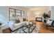 Bright and airy living room featuring hardwood floors and lots of natural light at 586 S Corona St, Denver, CO 80209