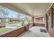 Covered front porch features brick pillars and a view of the street at 586 S Corona St, Denver, CO 80209