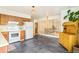 Spacious kitchen with newer appliances and a unique wood divider leading to the living room at 12193 W New Mexico Pl, Lakewood, CO 80228