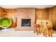 Retro-inspired living room features a brick fireplace and cozy bar area at 12193 W New Mexico Pl, Lakewood, CO 80228