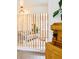 Bright living room with a wood divider, modern lighting, and a view of the backyard at 12193 W New Mexico Pl, Lakewood, CO 80228