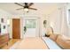 Comfortable main bedroom features wood floors, large windows, and modern furniture at 12193 W New Mexico Pl, Lakewood, CO 80228