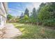 Expansive backyard featuring lawn, mature trees, and a paved area, perfect for entertaining or relaxing at 4474 S Vrain St, Denver, CO 80236