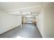 Expansive basement area ready for customization, with exposed ceiling and natural light at 4474 S Vrain St, Denver, CO 80236