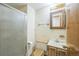 Small bathroom featuring a shower stall, toilet and vanity with mirror at 4474 S Vrain St, Denver, CO 80236