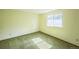 Bedroom with green carpet and a window overlooking the backyard at 4474 S Vrain St, Denver, CO 80236