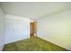 Standard bedroom with green carpet, white walls, and a closet at 4474 S Vrain St, Denver, CO 80236
