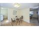Bright dining area featuring a glass table, seating for four, and an open layout at 4474 S Vrain St, Denver, CO 80236