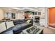 Finished basement features a large sectional, kitchenette, game area, and unique play space at 14096 Roaring Fork, Broomfield, CO 80023