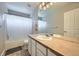 Bathroom featuring a tub with shower, large vanity, and neutral tones at 14096 Roaring Fork, Broomfield, CO 80023