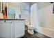 Bathroom featuring a white vanity, tub with shower, and neutral tones at 14096 Roaring Fork, Broomfield, CO 80023