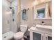 Modern bathroom featuring a glass-enclosed shower, neutral tones and modern fixtures at 14096 Roaring Fork, Broomfield, CO 80023