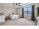 Bedroom featuring a bed in front of a large window with black-out curtains at 14096 Roaring Fork, Broomfield, CO 80023