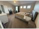 Bright bedroom with vaulted ceilings, neutral tones, and a large window at 14096 Roaring Fork, Broomfield, CO 80023