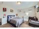 Comfortable bedroom with a cozy couch and decorative shelves at 14096 Roaring Fork, Broomfield, CO 80023