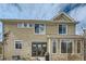 Exterior of home showing the backyard, windows, doors and siding at 14096 Roaring Fork, Broomfield, CO 80023