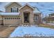 Charming front entrance featuring an arched doorway and space for decorative planters at 14096 Roaring Fork, Broomfield, CO 80023