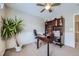 Well-lit office space with built-in shelving, desk and ample room for plants at 14096 Roaring Fork, Broomfield, CO 80023