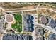 Aerial view showing townhomes near a playground and open green space at 16546 Umatilla Pl, Broomfield, CO 80023