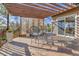 Outdoor deck featuring an eating area under a pergola, perfect for al fresco dining and enjoying the outdoors at 6360 S Gibraltar Cir, Centennial, CO 80016