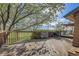 Expansive wooden deck with railing, offering outdoor space for dining and relaxation with scenic views at 6360 S Gibraltar Cir, Centennial, CO 80016