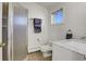 Clean and modern bathroom featuring a glass-enclosed shower, new sink, and neutral-toned tiles at 6360 S Gibraltar Cir, Centennial, CO 80016