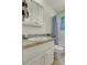 Cozy bathroom with vanity, granite countertop, mirrored cabinet, and shower-tub combo at 6360 S Gibraltar Cir, Centennial, CO 80016