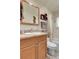 Cozy bathroom featuring wood vanity and shower-tub combo at 6360 S Gibraltar Cir, Centennial, CO 80016