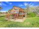 Exterior of home highlighting the back deck, landscaping, and outdoor space at 6360 S Gibraltar Cir, Centennial, CO 80016
