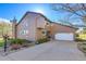Charming two-story home with a large driveway and attached two-car garage at 6360 S Gibraltar Cir, Centennial, CO 80016