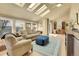 Bright living room with skylights, hardwood floors, and comfortable seating at 6360 S Gibraltar Cir, Centennial, CO 80016