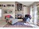 Cozy living room featuring a stone fireplace, comfortable seating, and natural light at 6360 S Gibraltar Cir, Centennial, CO 80016