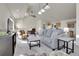 Open-concept living space with comfortable seating, stylish decor, and seamless flow to the kitchen area at 6360 S Gibraltar Cir, Centennial, CO 80016