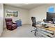 Functional home office with a comfortable chair, desk, and ample natural light at 6360 S Gibraltar Cir, Centennial, CO 80016