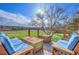 Relaxing deck with comfortable seating, offering views of the serene surrounding greenery at 6360 S Gibraltar Cir, Centennial, CO 80016