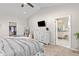 Bedroom featuring a walk-in closet, ensuite bath, ceiling fan, and comfortable furnishings at 20795 Scenic Park Dr, Parker, CO 80138