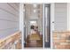 View from doorway into the entryway with a hallway leading into the living area at 20795 Scenic Park Dr, Parker, CO 80138