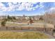 View of the neighborhood park and playground with walking paths and ample green space at 20795 Scenic Park Dr, Parker, CO 80138