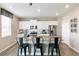 Modern kitchen with white cabinets, stainless steel appliances, and an island at 43054 Merion Hills Ct, Elizabeth, CO 80107