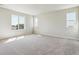 Spacious bedroom with plush carpet, large windows, and plenty of natural light at 14366 Heritage Dr, Mead, CO 80504