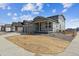 Well-kept exterior of the two story home with a two car garage and fenced in front yard at 14366 Heritage Dr, Mead, CO 80504