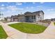 Inviting home showcasing a cozy front porch, a manicured lawn, and a charming neighborhood street view at 14366 Heritage Dr, Mead, CO 80504