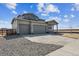 Charming two-story home featuring a three car garage and covered front porch at 14366 Heritage Dr, Mead, CO 80504