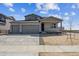 Attractive two-story home featuring a three car garage and covered front porch at 14366 Heritage Dr, Mead, CO 80504