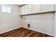 Laundry room with hardwood flooring and hook-ups at 14366 Heritage Dr, Mead, CO 80504