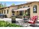 Backyard patio area with outdoor seating, a gas grill, and shade awning at 5904 Meadowbrook Dr, Morrison, CO 80465
