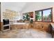 Spacious bathroom with a soaking tub and large windows at 5904 Meadowbrook Dr, Morrison, CO 80465
